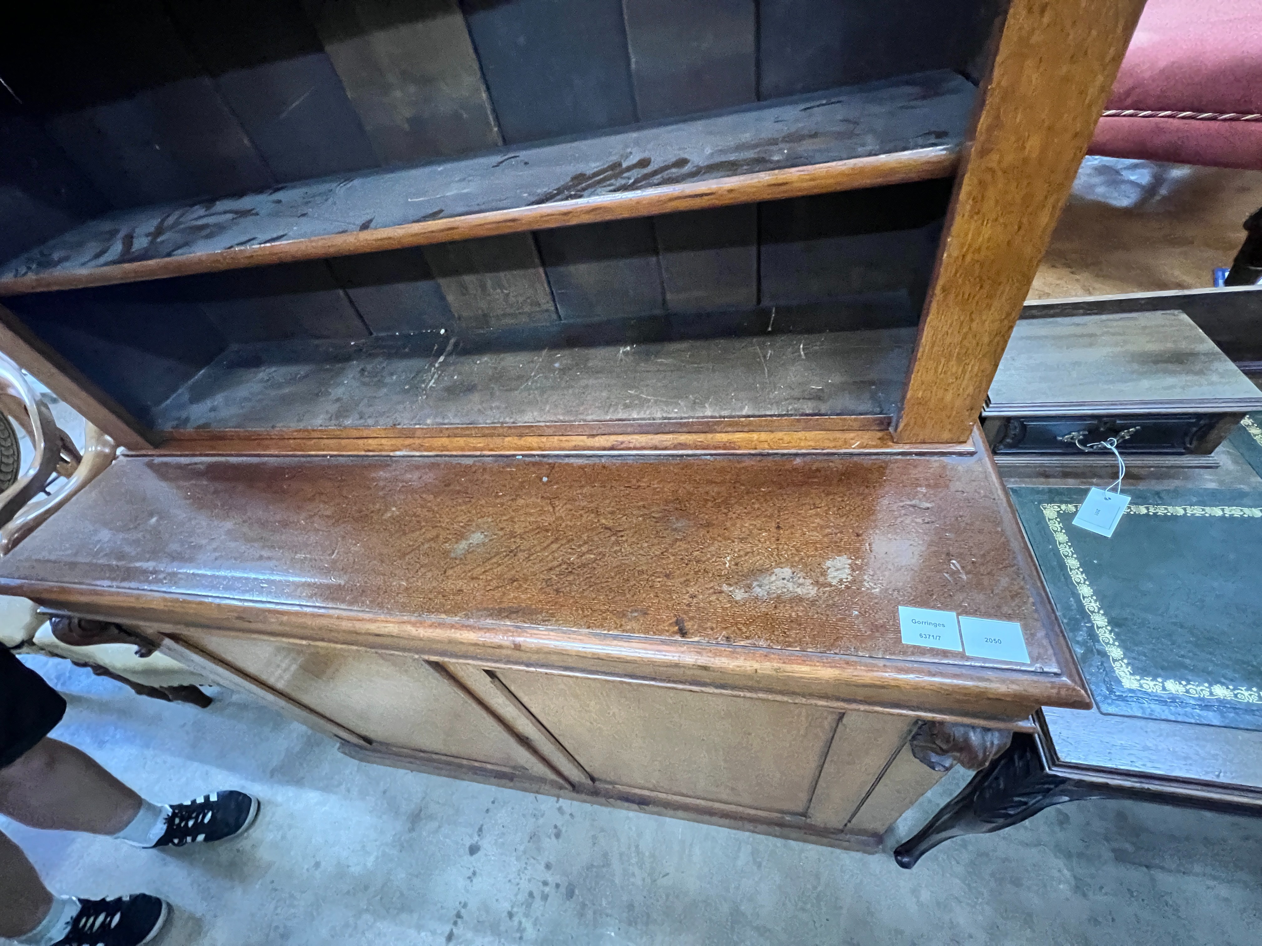 A late Victorian oak bookcase with twin panelled cupboard base, length 122cm, depth 51cm, height 207cm